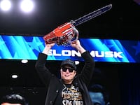Elon Musk holds a chainsaw reading "Long live freedom, damn it" during the annual Conservative Political Action Conference (CPAC) at the Gaylord National Resort & Convention Center at National Harbor in Oxon Hill, Maryland, on February 20, 2025. The chainsaw was a present to Elon Musk from Argentina's President Javier Milei. (Photo by SAUL LOEB / AFP) (Photo by SAUL LOEB/AFP via Getty Images)