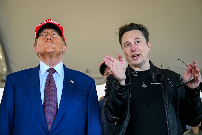 Elon Musk speaks with U.S. President Donald Trump as they watch the launch of the sixth test flight of the SpaceX Starship rocket on November 19, 2024 in Brownsville, Texas.
