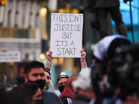 A photo of BLM protesters gathered at Times Square after the jury found former police officer Derek Chauvin guilty in the death of George Floyd.