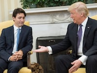 U.S. President Donald Trump (R) extends his hand to Prime Minister Justin Trudeau of Canada