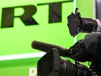 A camera stand for Russia's state-controlled Russia Today (RT) broadcaster is pictured at an event on May 24, 2018 in Saint Petersburg.