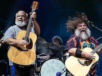 Kyle Gass, Jack Black, and bassist John Spiker of Tenacious D perform at PNC Music Pavilion on Sept. 6, 2023, in Charlotte, North Carolina.