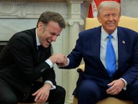 Donald Trump and Emmanuel Macron shake hands