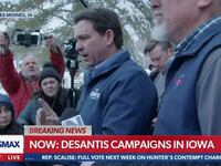 Ron DeSantis speaks to reporters.