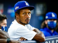 ARLINGTON, TX - OCTOBER 07: Terrance Gore #27 of the Los Angeles Dodgers looks on from the dugout during Game 2 of the NLDS between the Los Angeles Dodgers and the San Diego Padres at Globe Life Field on Wednesday, October 7, 2020 in Arlington, Texas. (Photo by Kelly Gavin/MLB Photos via Getty Images)