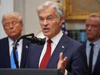 WASHINGTON, DC - SEPTEMBER 22: Administrator for the Centers for Medicare & Medicaid Services Mehmet Oz (C) delivers remarks as U.S. President Donald Trump (L) and U.S. Health and Human Services Secretary Robert F. Kennedy Jr. (R) look on during an announcement by President Donald Trump on “significant medical and scientific findings for America’s children” in the Roosevelt Room of the White House on September 22, 2025 in Washington, DC. Federal health officials suggested a link between the use of acetaminophen during pregnancy as a risk for autism, although many health agencies have noted inconclusive results in the research. (Photo by Andrew Harnik/Getty Images)