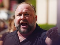 InfoWars founder Alex Jones speaks to the media outside Waterbury Superior Court during his trial on September 21, 2022 in Waterbury, Connecticut. Jones is being sued by several victims' families for causing emotional and psychological harm after they lost their children in the Sandy Hook massacre. A Texas jury last month ordered Jones to pay $49.3 million to the parents of 6-year-old Jesse Lewis, one of 26 students and teachers killed in the shooting in Newtown, Connecticut. (Photo by Joe Buglewicz/Getty Images)
