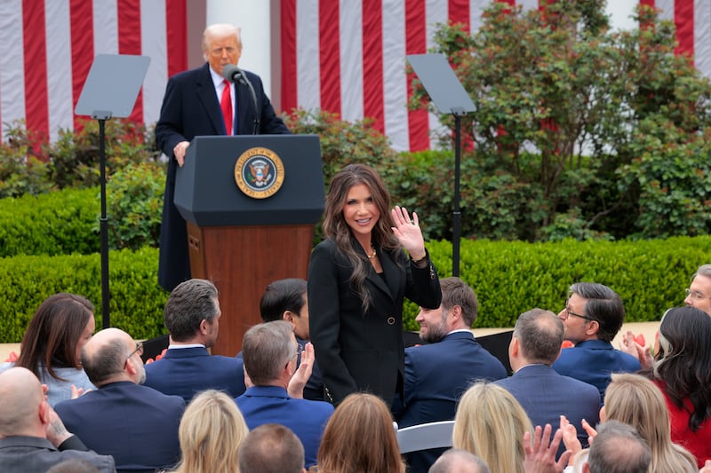 Kristi Noem and Donald Trump.
