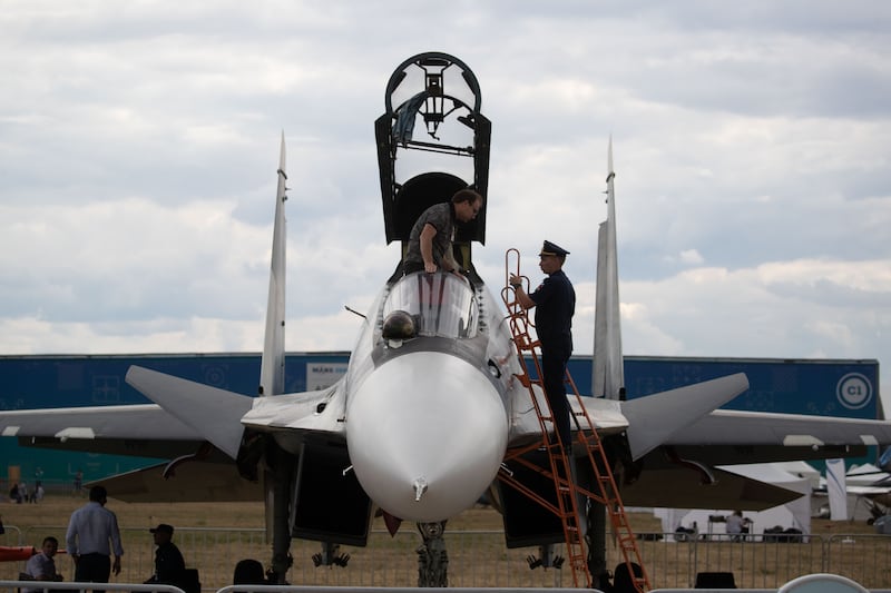 People look at a Su-30SM fighter aircraft during the closing day of the International Aviation and Space Salon MAKS-2021 in a Moscow suburb, Russia, on July 25, 2021. (Photo by Bai Xueqi/Xinhua via Getty Images)