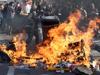 AUBERVILLIERS, FRANCE - OCTOBER 1: French students set fires as they clash with police during a march through the streets of Aubervilliers, on October 1, 2026 in Aubervilliers, a northern suburb of Paris, France. In a wave of demonstrations that began around Paris last week and spread across France, secondary students have blockaded schools in protest against overcrowded classrooms, teacher shortages, and long class schedules. According to French Interior Minister Laurent Nunez, more than 400 have been detained, many of them minors, as some protests turned violent where students and police clashed. (Photo by Tom Nicholson/Getty Images)