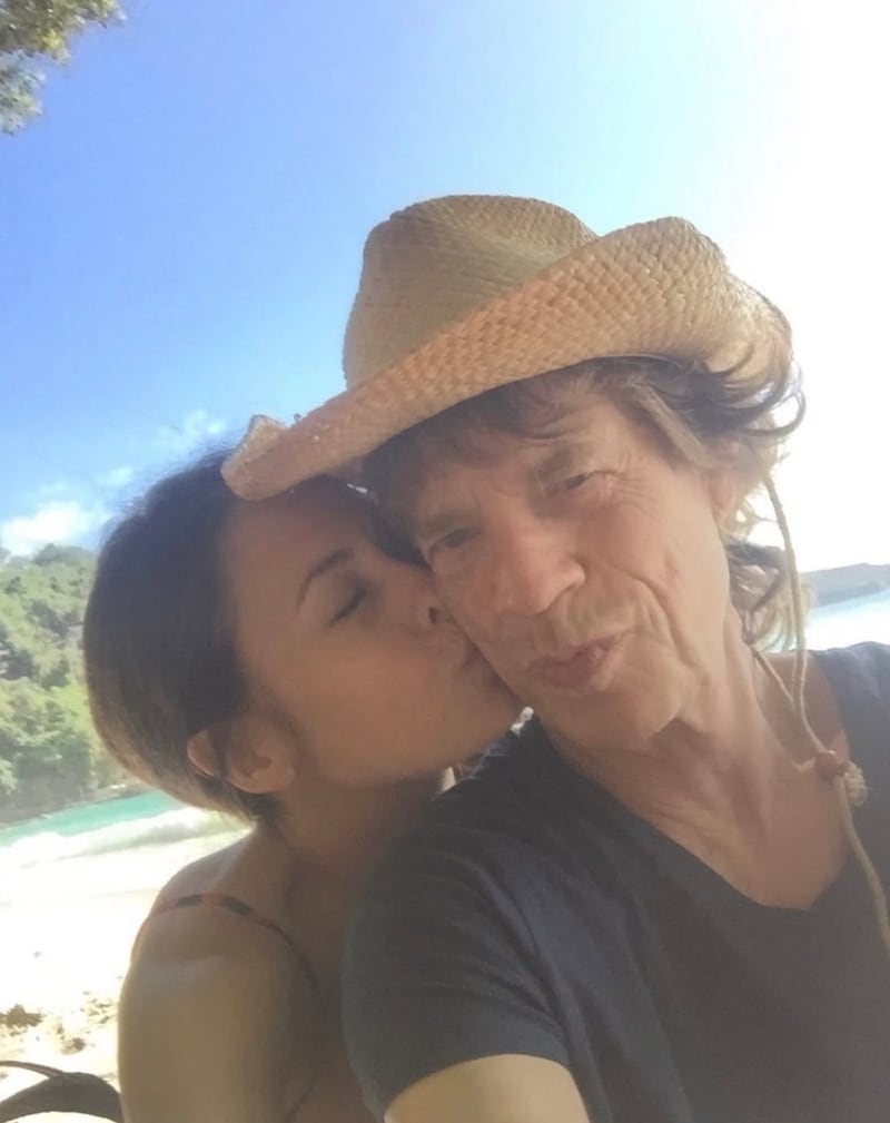 Melanie Hamrick and Mick Jagger packed on kisses on a beach vacation.
