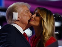 Melania Trump hugs Donald Trump on stage at the RNC.