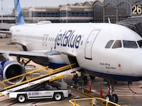WASHINGTON, D.C. - APRIL 24, 2018: A JetBlue Airways Airbus A320 jet is serviced at a gate at Ronald Reagan Washington National Airport in Washington, D.C. (Photo by Robert Alexander/Getty Images)