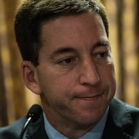 Investigative reporter Glenn Greenwald, who worked with National Security Agency leaker Edward Snowden, speaks at a press conference after accepting the George Polk Award along side Laura Poitras, Ewan MacAskill and Barton Gellman, for National Security Reporting on April 11, 2014 in New York City. Greenwald, Poitras and MacAskill reported on the story for The Guardian; Gellman wrote for The Washington Post. This is the first time Greenwald and Poitras have returned to the United States since the story broke. (Photo by Andrew Burton/Getty Images)