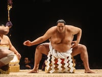 Akebono Taro, born in Hawaii as Chad Rowan, performs a ritual prior to a match in the 1993 San Jose Basho sumo wrestling tournament held June 4-5, 1993 at the San Jose Event Center in San Jose, California.