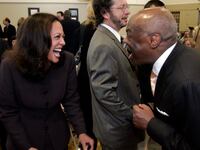 Kamala Harris facing Willie Brown in a crowd, both laughing