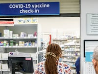 Miami Beach, Florida, Walgreens, Pharmacy and counter Covid-19 vaccine check-in sign.