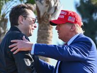 U.S. President Donald Trump greets Elon Musk as he arrives to attend a viewing of the launch of the sixth test flight of the SpaceX Starship rocket on November 19, 2024 in Brownsville, Texas.