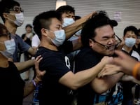 articles/2014/10/03/hong-kong-between-calm-and-chaos/141003-leung-hong-kong-tease_eeb4j4