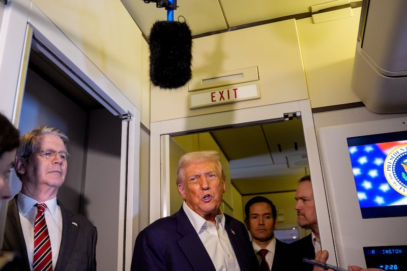 Trump talks to reporters on Air Force One