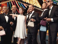articles/2014/12/29/handbags-the-more-you-pay-the-smaller-they-shrink/141228-landers-mini-bag-tease_klx6j9