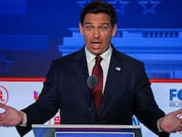 Ron DeSantis speaks with his hands up during the second GOP debate.