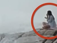A woman doing yoga was swept into the sea.