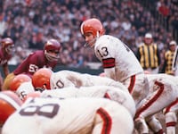 Cleveland Browns quarterback Frank Ryan (#13, White Jersey) calls the signals before the ball is snapped from center in third quarter action, December 5, in game between Cleveland Browns and Washington Redskins