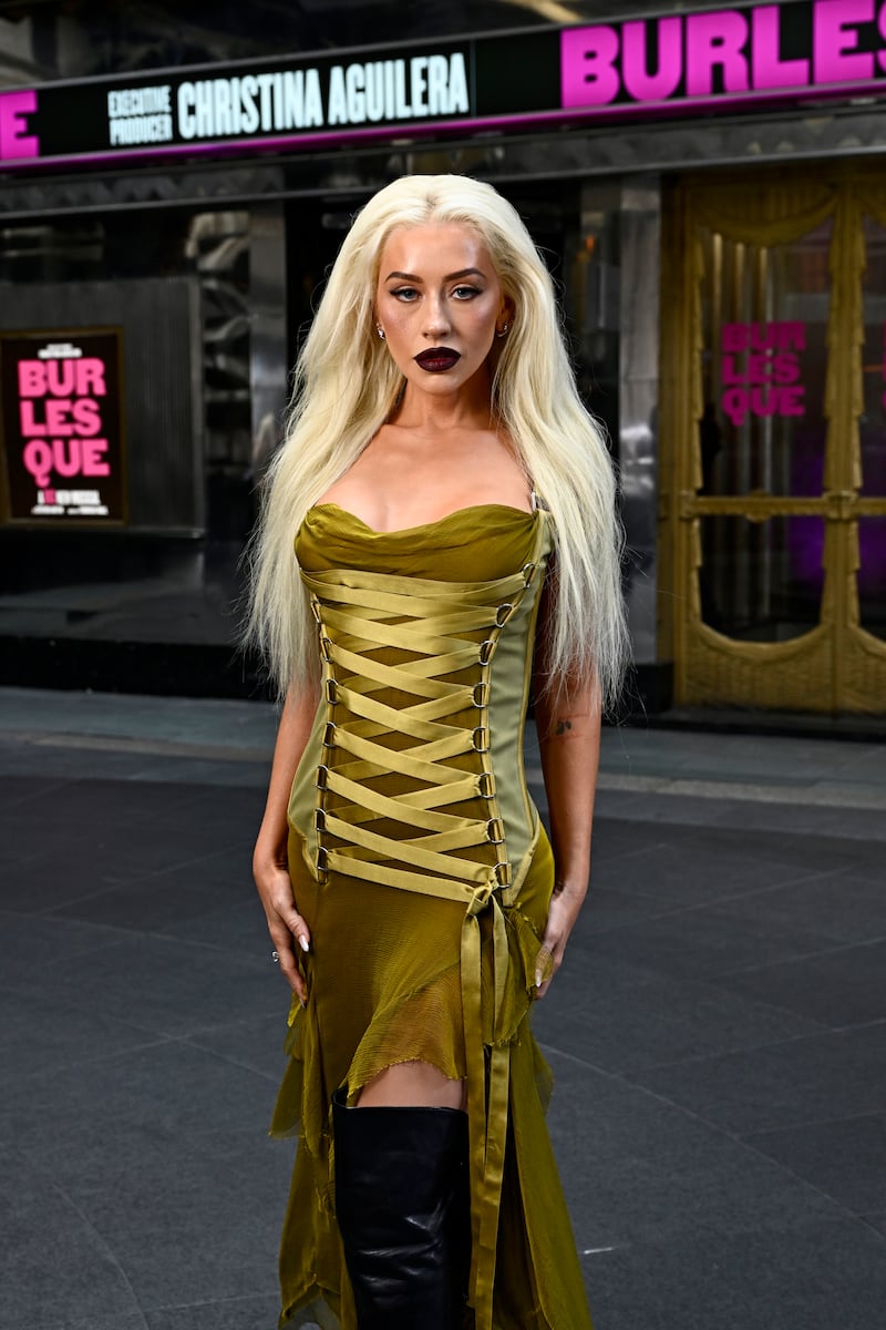 "Burlesque" was turned into a stage musical in 2024. Aguilera rocked a red lip at a photocall in London, 2025.
