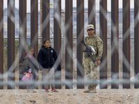 Migrants cross the Rio Grande