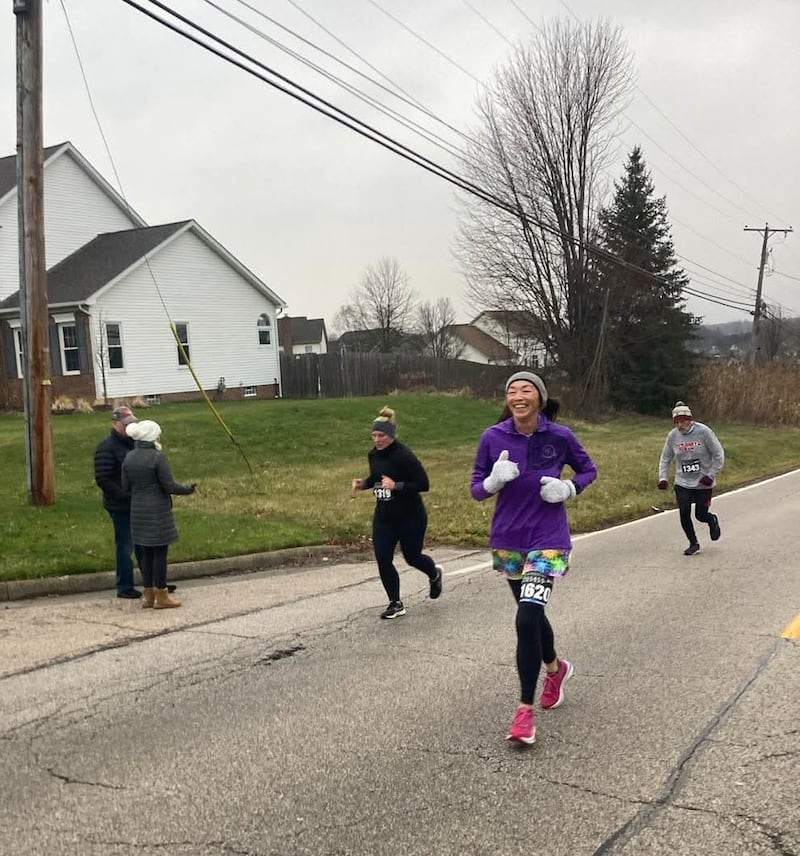 Lonnie Zofchak is pictured running in a race.