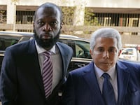 Grammy award-winning Fugees rapper Prakazrel (Pras) Michel, who is facing criminal charges in an alleged illegal lobbying campaign, arrives with his lawyer David Kenner for opening arguments in his trial at U.S. District Court