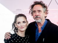 Winona Ryder and director Tim Burton attend the Tim Burton Hand and Footprint Ceremony on September 8, 2016.