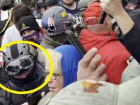 Joseph Pavlik, circled in yellow, wearing a gas mask among a crowd of Jan. 6 rioters