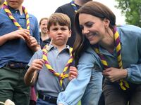 Britain’s Prince George of Wales, Prince Louis of Wales and Catherine, Princess of Wales, toast marshmallows as they take part in the Big Help Out, during a visit to the 3rd Upton Scouts Hut in Slough, west of London, Britain, May 8, 2023.