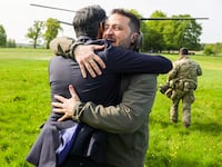 Rishi Sunak and Volodymyr Zelensky embrace.