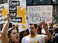 L.A. Times Guild journalists rally in front of City Hall to protest against layoffs and changes to job seniority protections during a walkout of the Los Angeles Times newspaper.