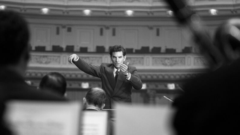 A photo including Bradley Cooper as Leonard Bernstein in the film Maestro