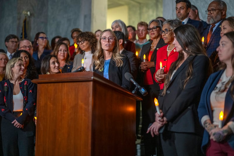 TOPSHOT - Annie Farmer, victim of convicted sex offender Jeffrey Epstein, speaks from the podium during a candlelight vigil to honor survivors of his crimes in Washington, DC on November 18, 2025. The US Senate on Tuesday approved a House-passed bill ordering the release of federal files on Jeffrey Epstein, the disgraced financier whose extensive alleged sex trafficking network fueled one of the country's most incendiary scandals. (Photo by DANIEL HEUER / AFP) (Photo by DANIEL HEUER/AFP via Getty Images)