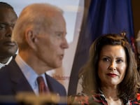 Joe Biden speaks as Michigan Governor Gretchen Whitmer looks on at an event in Grand Rapids, Michigan.