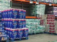 A customer is looking for a 30-pack of toilet paper from a store shelf in Edmonton, Alberta, Canada, on March 2, 2025.