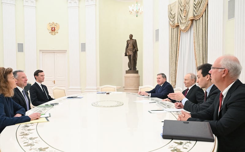 In this pool photograph distributed by the Russian state agency Sputnik, Russia's President Vladimir Putin, accompanied by Kremlin economic envoy Kirill Dmitriev and Kremlin aide Yuri Ushakov, meets with US special envoy Steve Witkoff and US President Donald Trump's son-in-law Jared Kushner at the Kremlin