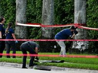 Members of FBI are seen at the crime scene outside the Trump International Golf Club in West Palm Beach, Florida, on Sunday.