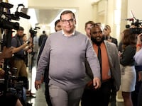 Rep. George Santos (R-NY) leaves a House Republican conference meeting in the Longworth House Office Building