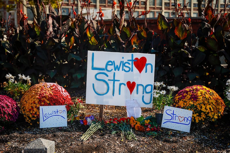 A photo including a Lewiston's strength sign along with a Bonquet of Flowers