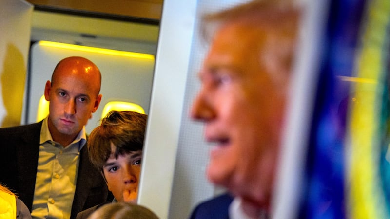 President Donald Trump (R), accompanied by White House press secretary Karoline Leavitt (L), White House Deputy Chief of Staff Stephen Miller