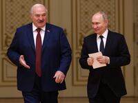 Russian President Vladimir Putin and Belarussian President Alexander Lukashenko enter the hall during their meeting at the Palace of Independence, on May 24, 2024, in Minsk, Belarus.