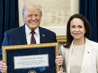 Venezuelan opposition leader Maria Corina Machado presents Donald Trump with her Nobel Peace Prize.