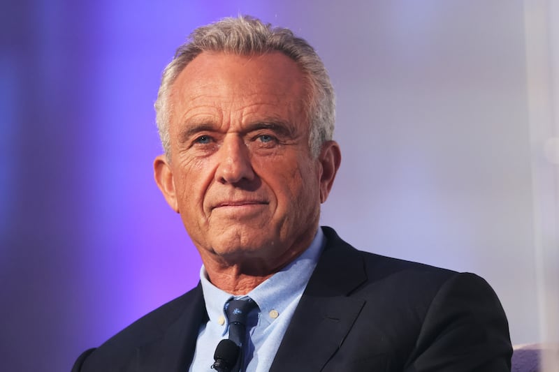 Robert F. Kennedy Jr. listens as he is introduced by Rabbi Shmuley Boteach during the World Values Network's Presidential candidate series at the Glasshouse on July 25, 2023 in New York City.