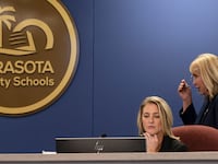 Board member Bridget Ziegler, seated at a Sarasota County School Board meeting in Sarasota, Fla.